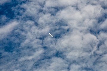 Wall Mural - War jet plane among cloudscape