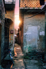 Wall Mural -   Around chinese hutongs in Guangzhou city, which are a type of narrow streets or alleys in typical neighborhoods with old houses.          