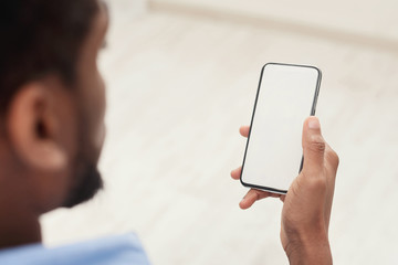 Man using mobile smartphone with blank screen