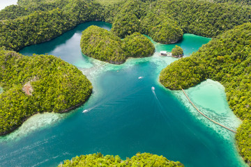 Cove and blue lagoon among small islands covered with rainforest. Sugba lagoon, Siargao, Philippines. Aerial view of Sugba lagoon, Siargao,Philippines.