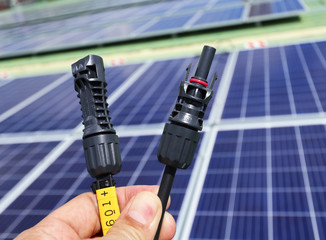 Canvas Print - Solar PV Connectors Male and Female Hand Holding