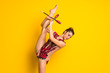 Girl doing rhythmic gymnastics with maces.