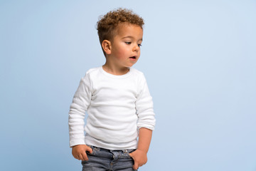 kid over isolated blue background