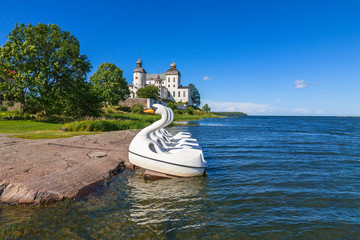 Sticker - Lacko castle at lake Vanern in sweden with pedal swans at the lakeshore