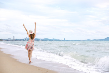 Wall Mural - Travel woman walking on beach