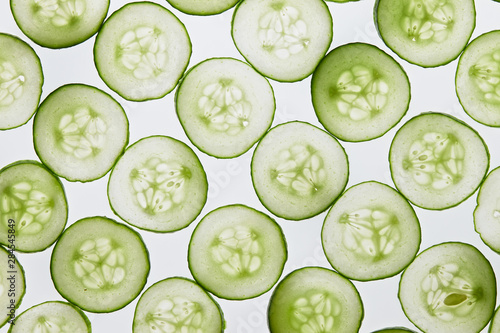 Fotomural Fresh cucumber slices on a white background