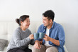 © chayathon2000 - Asian senior grand mother and son drinking coffee and talking happy and smile face in living room