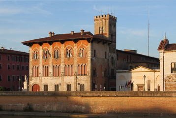 Wall Mural - Gothic facade at Palazzo Medici in Pisa, Italy, in the evening sun