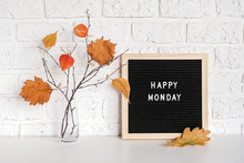 Happy Monday Text On Black Letter Board And Bouquet Of Branches With Yellow Leaves On Clothespins In Vase On Table Template For Postcard, Greeting Card Concept Hello Autumn Monday