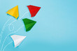 © Nana_studio - Color paper airplanes on blue background. Different vision creative and Innovative solution for Business concepts.