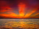 Fototapeta Most - Colorful sunset over ocean on tropical island