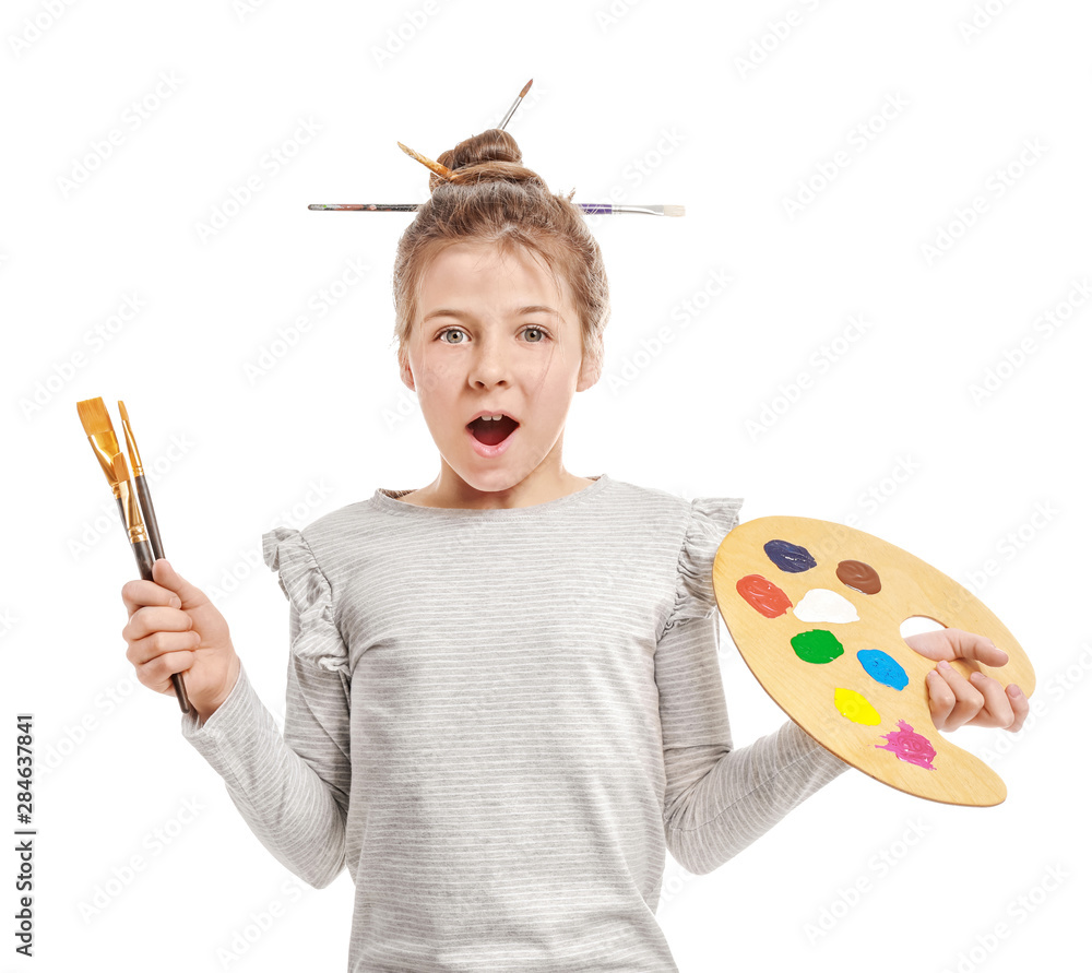 Surprised little artist on white background