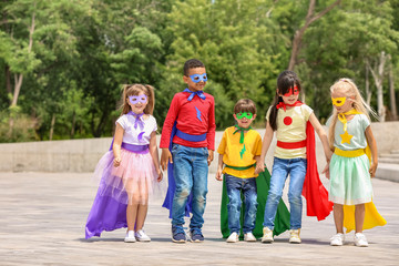 Sticker - Cute little children dressed as superheroes outdoors