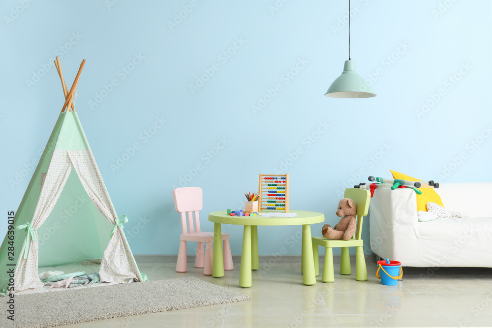 Interior of modern children's room with teepee