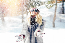 Woman Plays With Snow