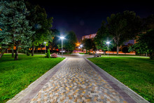 Beautiful City Park Walkway With Lamps At Night