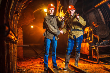 Two miners in the mine