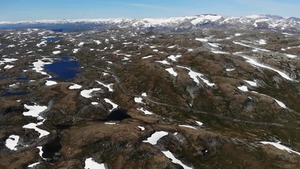 Wall Mural - Summer mountains landscape with snow and lakes. National tourist scenic route 55 Sognefjellet in Norway