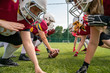 © Sergey Mironov - Photo of athletes women wearing white helmets playing american football on sports field