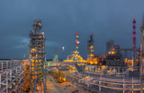 Fototapeta  - view of metal pipes of industrial plant outdoor at night 