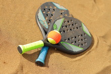 Beach Tennis Rackets In The Sand