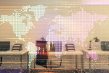 Stock and bond market graph and world map with trading desk bank office interior on background. Multi exposure. Concept of international finance