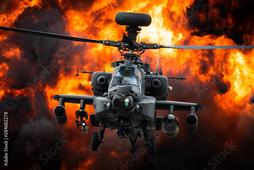 Cuadros en Lienzo A AH-64 Apache attack helicopter in front of a large explosion.
