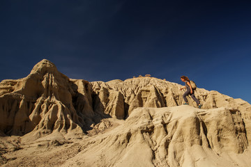 Wall Mural - A hiker in the Artist`s Palette landmark place in Death Valley National Park, Geology, sand.