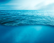 wavy sea water surface with sky and underwater 