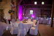 lovely pink themed Loft Wedding Party with pink ambience light and white chair covers