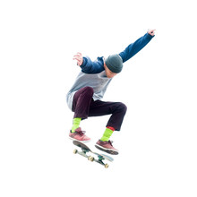 Teenager Skateboarder Jumps Ollie On An Isolated White Background. The Concept Of Street Sports And Urban Culture