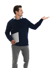 Wall Mural - Young male teacher with laptop on white background