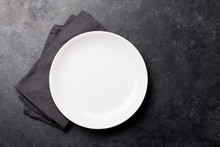 Kitchen Table With Empty Plate And Towel