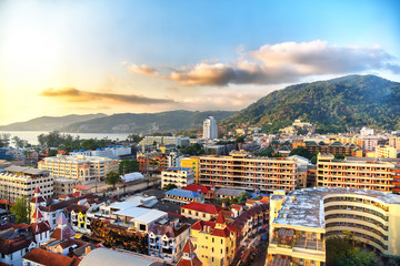 Aerial view of Patong beach, Phuket island and sea, urban city with blue sky. Andaman sea, Thailand.