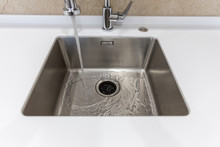 Stainless Kitchen Sink With Food Waste Disposal In Modern Home