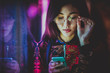 © oneinchpunch - Pretty asian woman portrait with led lights