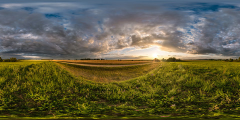 Wall Mural - full seamless spherical hdri panorama 360 degrees angle view among fields in summer evening sunset w