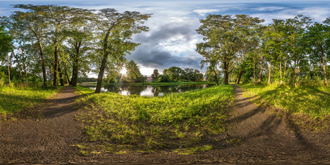 Wall Mural - full seamless spherical hdri panorama 360 degrees angle view on pedestrian walking path among oak grove near lake in equirectangular projection with zenith, ready VR AR virtual reality content