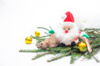 © silentalex88 - decorative cute brown rat sitting on the branches of the Christmas tree with a Christmas decor and Santa Claus. The rat is a symbol Of the new year 2020