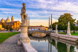 View of canal with statues on square Prato della Valle and Basilica Santa Giustina in Padova (Padua), Veneto, Italy