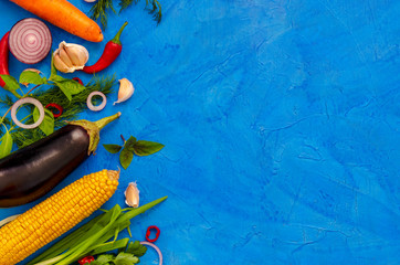 food background photo of different vegetables on blue background