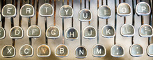 Close Up Of Three Rows Of Letter Keys On A Vintage Rusted Typewriter Viewed From Above