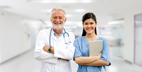 Wall Mural - Senior doctor working with young doctor in the hospital. Medical healthcare staff and doctor service.