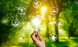 Leinwandbild Motiv Green energy innovation light bulb with future industry of power generation icon graphic interface. Concept of sustainability development by alternative energy.