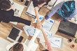 © InfiniteFlow - Businessmen and businesswomen joining hands in group meeting at multicultural office room showing teamwork, support and unity in business. Diversity workplace and corporate people working concept.