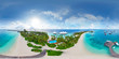Aerial spherical panorama of tropical paradise beach  on tiny Maldives island. Turquoise ocean and white sand. Small bungalows between coconut palm trees