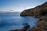 Fototapeta  - Sunset in the Vale de Centianes Beach, Carvoeiro, Algarve, Portugal. Selective focus and silk effect.