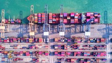 4K Timelapse Of Modern Industrial Port With Containers From Top View Or Aerial View. It Is An Import And Export Cargo Port Where Is A Part Of Shipping Dock.Singapore