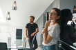 © Yevhenii - Indoor shot of married couple in the kitchen, focus on husband. He is wearing black t-shirt and looking away