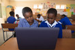© Wavebreak Media - Schoolchildren using laptop in a lesson at a township school